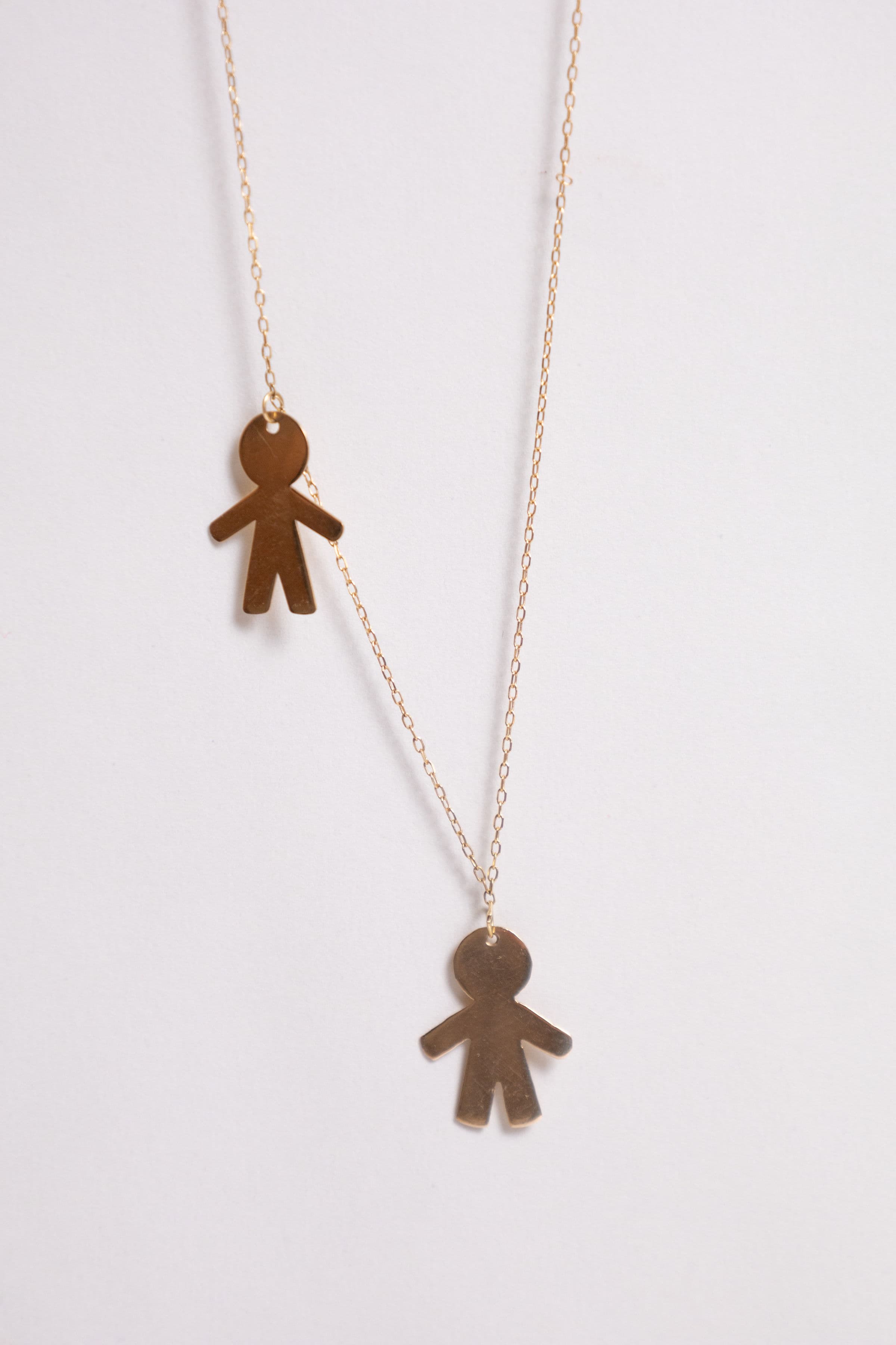 Cadena oro: dos niños